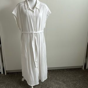 Long, white, short sleeve, button down dress.